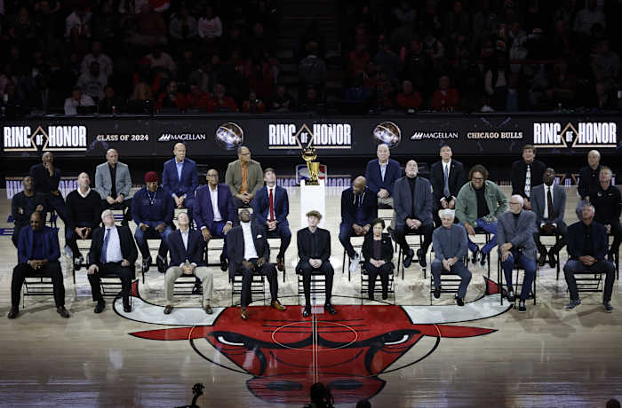 Chicago Bulls class of 2024 Ring of Honor inductees from left to right, (Back Row) Jim Cleamons, Erik Heiland, Ivika Duran, Clarence Gaines, Jr., John Ligmanowski, Chip Schaefer, Jim Stack, Al Vermeil (Middle Row) Randy Brown, Jud Buechler, Jason Coffey, James Edwards, Jack Haley, Jr., Ron Harper, Bill Wennington, Luc Longley, John Salley, Steve Kerr (Front Row) Artis Gilmore, Matt Kerr, Greg Klein, Bob Love, JJ Parrish, Thelma Krause, Chris Winter, Phil Jackson, Toni Kukoc are honored during the inaugural ceremony at halftime of a game between the Bulls and Golden State Warriors at United Center.